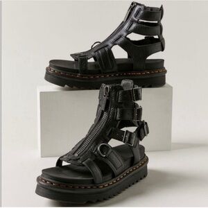 Dr. Martens OLSON TUMBLED
NUBUCK LEATHER GLADIATOR ZIP
SANDALS